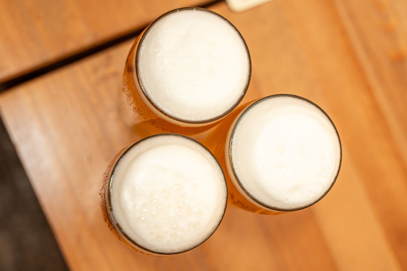 Three craft beers on a table, ready for a guided tasting